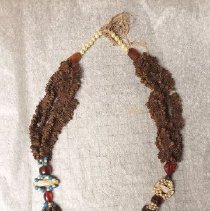 Necklace made of strung cloves and beads