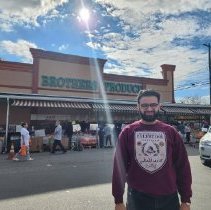 George Harb Posing in front of Brother's Produce