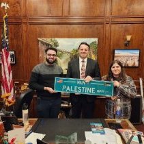 Mayor Sayegh, George Harb and Shatha Najim holding the street sign
