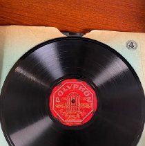 Record with red Polyphon Musik label, Arabic script in gold ink with logo