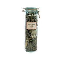 Glass cylinder jar with amunition shells and doll head