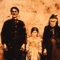 Sepia slide of elderly couple with young girl