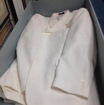 White suitjacket in storage box