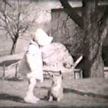 Still of child with farm cat circa 1940