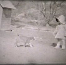 Still of child with farm cat circa 1940