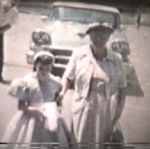 Still from video of family christening circa 1960