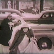 Still of bride and attendants entering a church from a car circa 1940