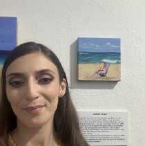 isobelle Yousef with her artwork at an exhibit