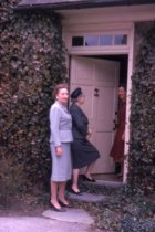 Mrs. Ralph Earle greets guests. 1961