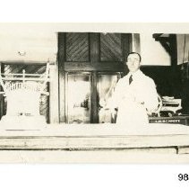 [Unidentified man in butcher shop]
