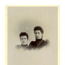 [Two Women in Identical Dresses]