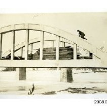 [Woman climbing Freeport Bridge]