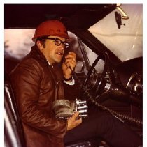 [John Arajs in a car]