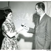 [Bob McKeown and an unidentified woman on the Bazaar set]