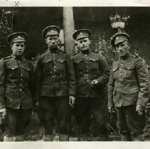 George Schneider and a group of unidentified soldiers
