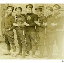 George Schneider and a group of unidentified soldiers