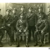 George Schneider and a group of unidentified soldiers