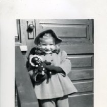 [Jane Snider holding Topsy doll]