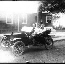Estella West and friends in J. I. West's auto