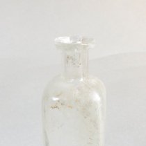 Clear Glass Medicine Bottle - Side 1