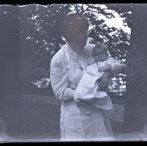 Lady Holding a Baby at Lake Waramaug