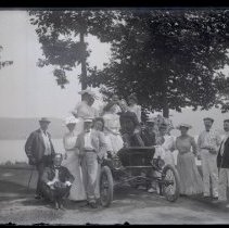 Group of People around Car at Lake Waramaug