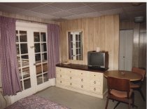 "Inside Ding's cabin at 'Tween Waters looking toward back porch."