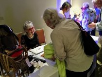 The author signs her book, "A Bubble Moment"