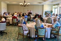Pat and Mike Boris present candles to Shirley and Warren Stanton