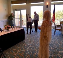 Susen Berg watches Board of Associates Chairman Chip Roach