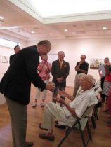 Ambassador Petr Gandalovic presents Karel Aster with 1 of  the 3 awards