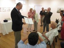 Czech Ambassador Petr Gandalovic presents Aster with 1 of 3 awards