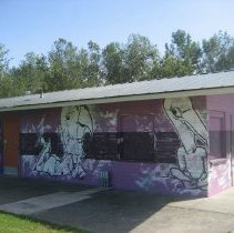 Close up of mural on bathroom building, 2016