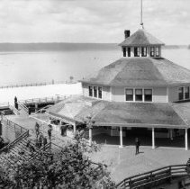 The boathouse first floor is to the left of the center structure,  c. 1921