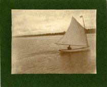 One man sailing in Harbor
