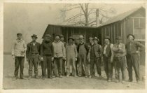 Men standing outside building