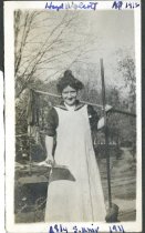 Hazel Wolert doing something to the roof at 814 South University.