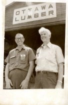 Two men outside of Ottawa Lumber.