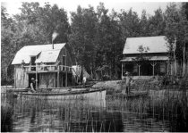 John M. Culp in rowboat on right.  Alanson?  Crooked Lake?