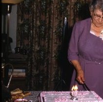Woman cutting cake