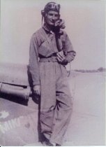 C. R. Brown standing next to Spitfire AC