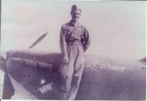 Lt. C. R. Brown standing on his Spitfire aircraft 1943