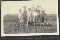 The medium sized boys at the pump