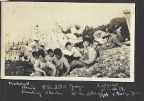 Boys sitting on rocks