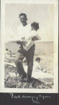 Fred carrying Agnes, Ida on rock