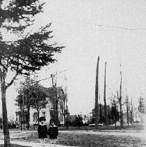 Girls in front of house on Queen Street at Homewood Avenue, Mount Forest, photograph, ca. 1920.