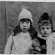 Portrait of two girls wearing winter clothes, photograph, ca. 1915.
