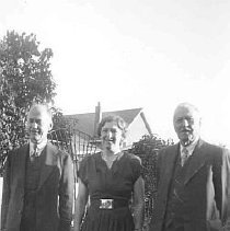 Members of Fischer family, man on left if F. Fischer, woman is Luella Fischer, Elora, ON. 16 October 1949.