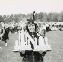 Highland dancer with trophy, Fergus Highland Games ca. 1950