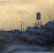 ph 15559: Water tower, railway track, locomotive.